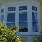 Double glazed windows with coloured glass inserts