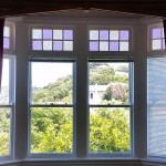 Double glazed windows with coloured glass inserts